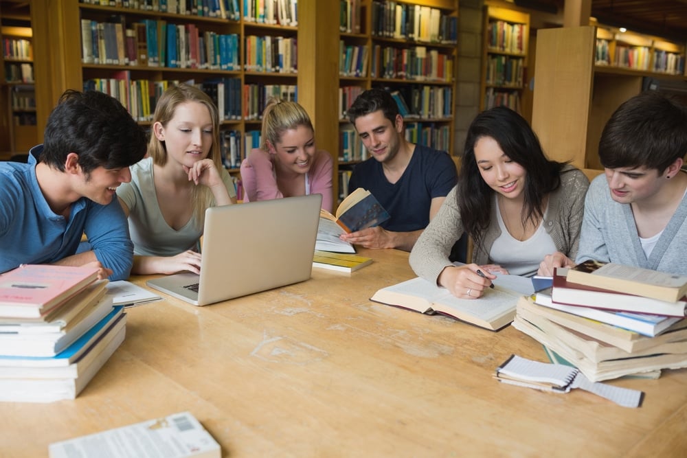 Students sitting at a table collaborating