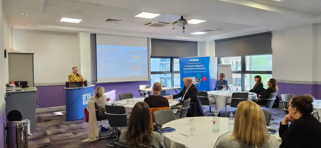 Haili Hughes presenting at IRIS Connect's Coach Empower Retain in Brighton on December 2024